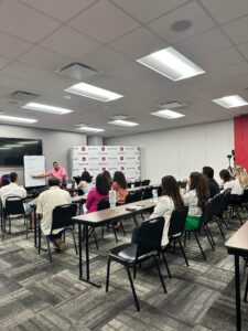 David Rodriguez speaking to a group of professionals during a bilingual mortgage and community education session.